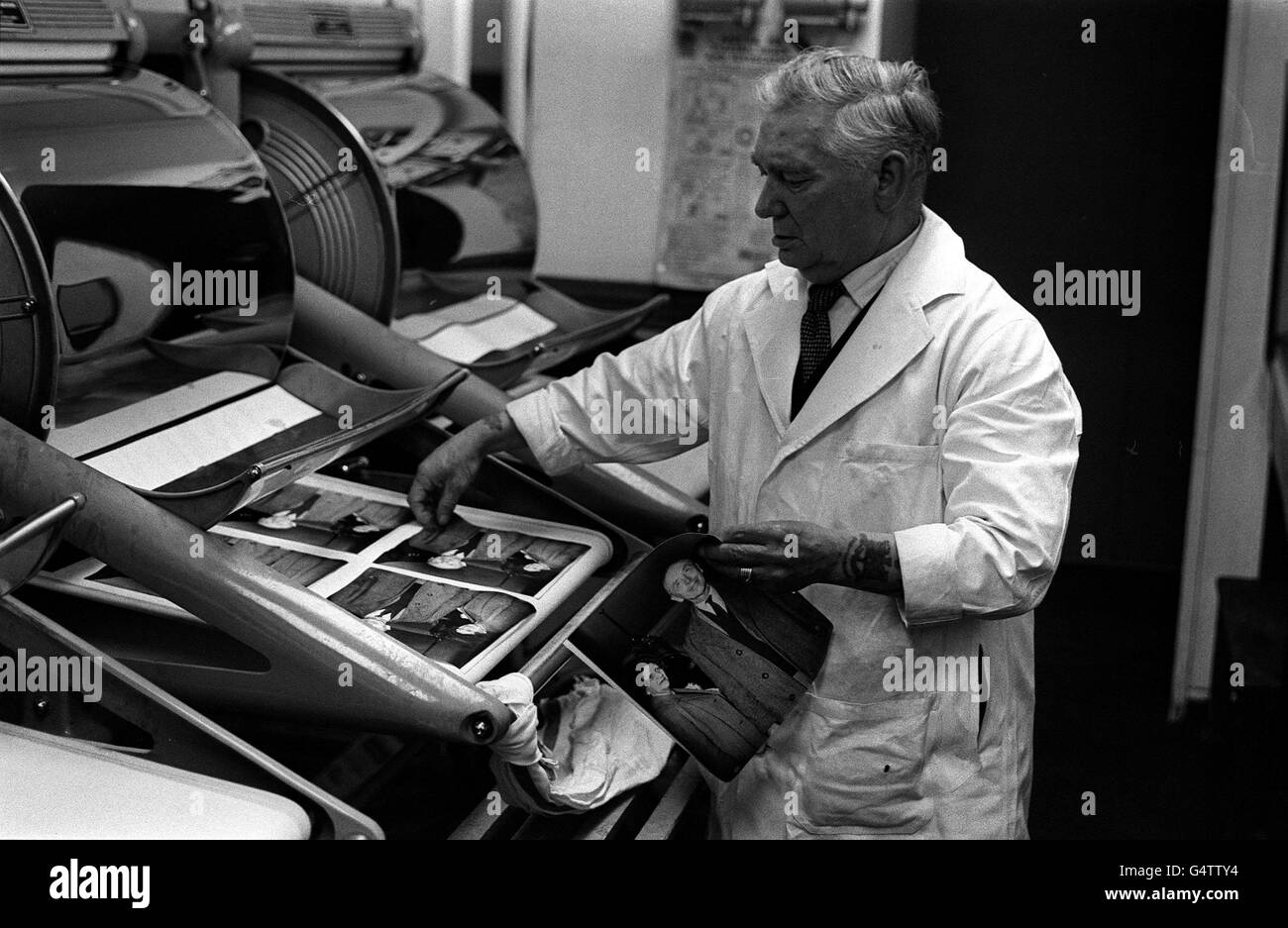 A busy worker in the darkroom on Election Night at the Press Association in Fleet Street, London Stock Photo