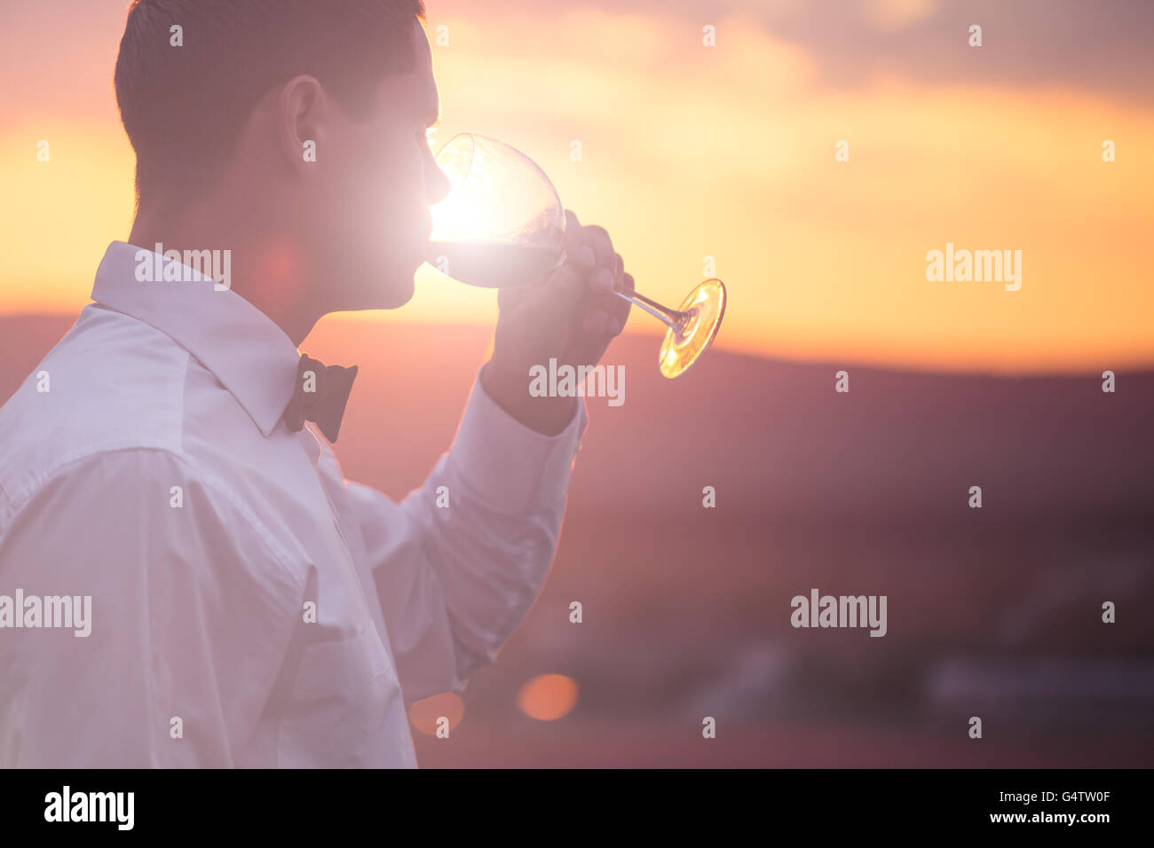 Man tasting red wine backlight hi-res stock photography and images - Alamy