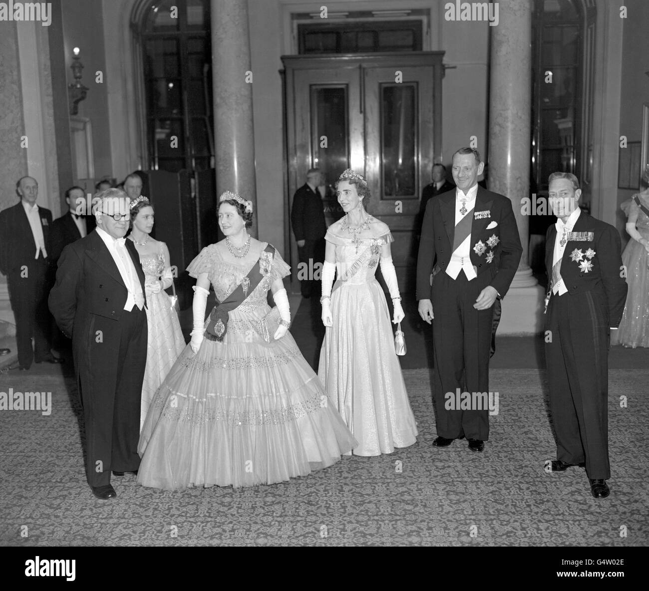 King George and Queen Elizabeth with King Frederik and Queen Ingrid of Denmark, Princess Margaret and Herbert Morrison (extreme left), the Foreign Secretary, during the Government reception at Lancaster House. Stock Photo