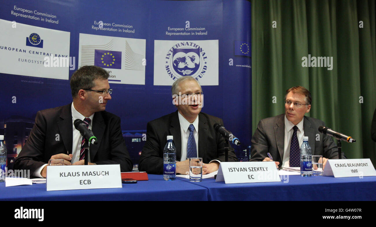 (From the left) Klaus Masuch (ECB), Istvan Szekely (EC) and Craig Beaumont (IMF) speak to the media at a press conference on the progress of Irelands Fourth Quarter 2011 debt repayment at Government Press Centre, Dublin. Stock Photo