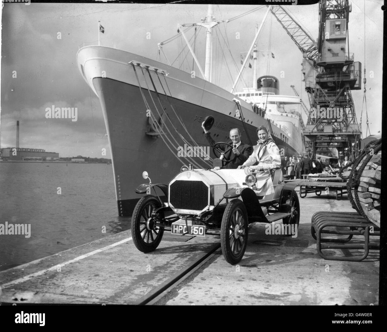 Lord and Lady Montagu in a 1909 Humber, on the quayside at Southampton, before leaving for South Africa. Stock Photo