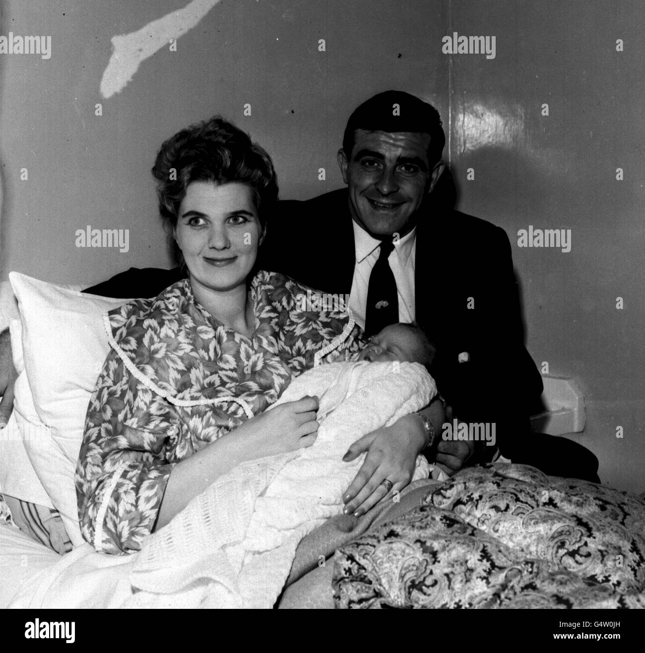 Yorkshire and England fast bowler Freddie Truman with his wife Enid and their first child Karen Susan, at the Belvedere Nursing Home Scarborough where the baby was born on May 7th 1960, weighing eight pounds. *Mrs Trueman is the daughter of Alderman Roy Chapman, a former mayor of Scarborough, Stock Photo