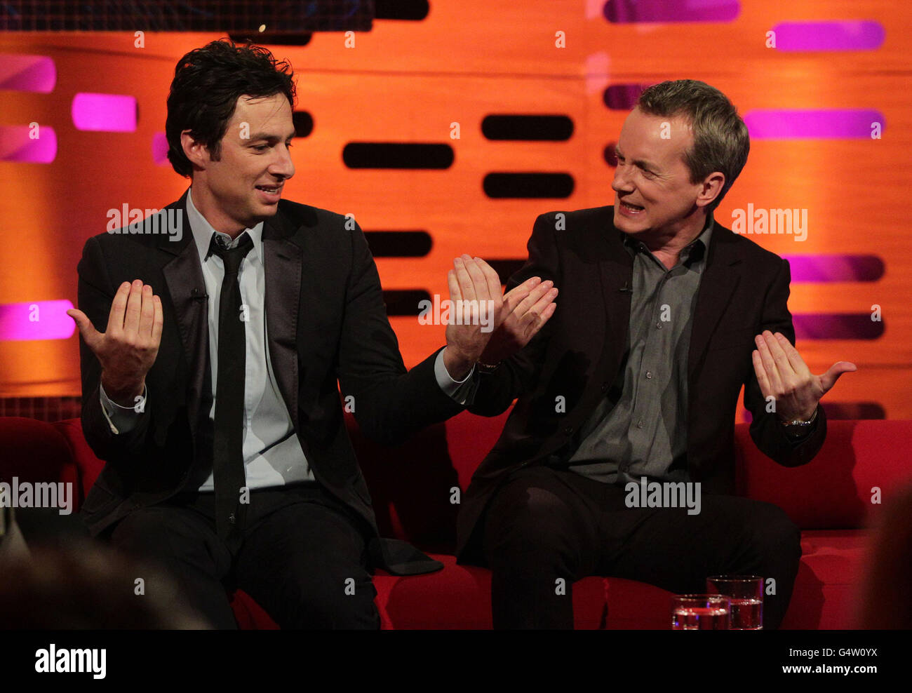 Guests Zach Braff (left) and Frank Skinner during filming of The Graham Norton Show at The London Studios in south London. Stock Photo