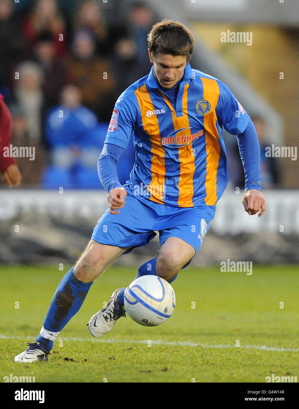 Shrewsbury Town's Shane Cansdell-Sherriff on the ball before he was later streachered off injured during the npower Football League Two match at Greenhous Meadow, Shrewsbury. Stock Photo