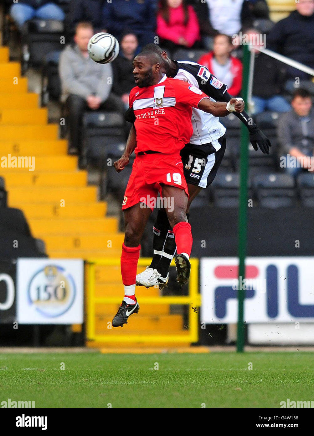 MK Dons Jabo Ibehre and Notts County's Damion Stewart (right) battle