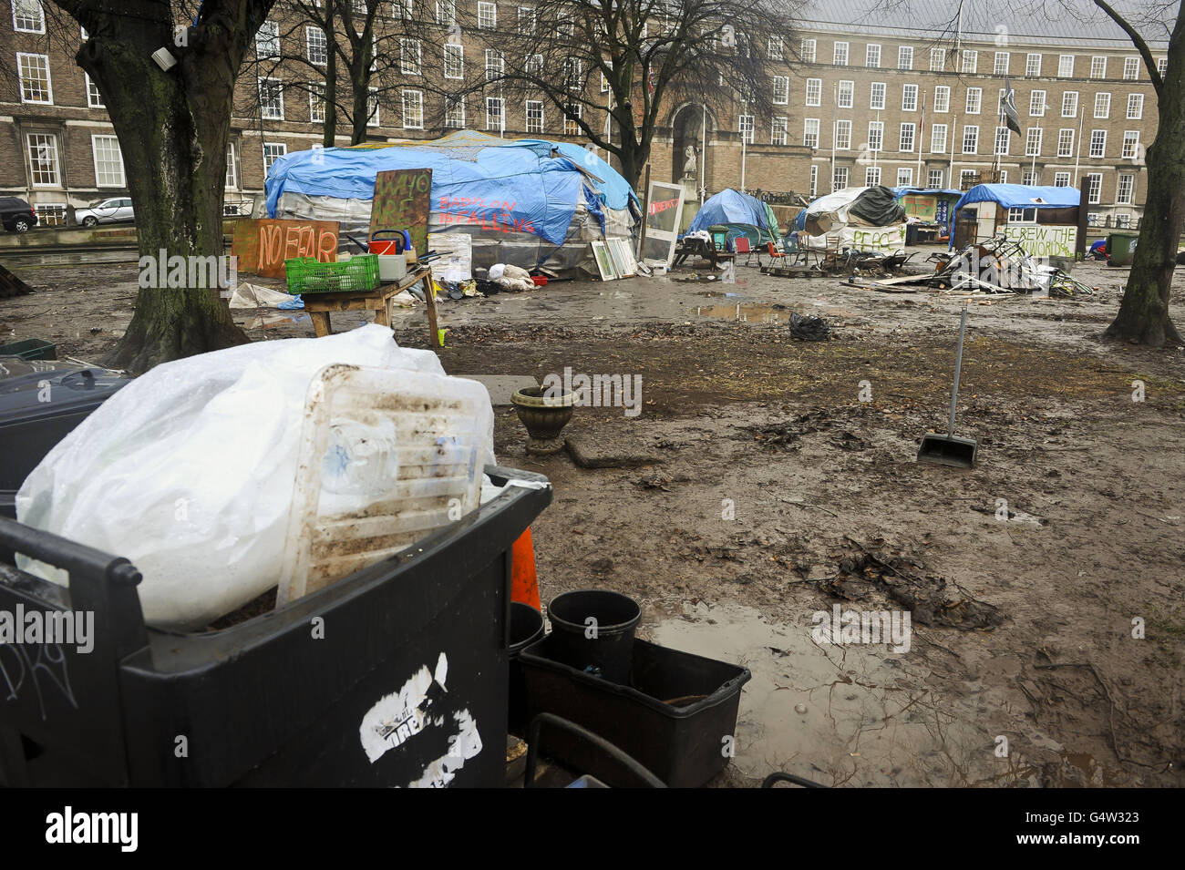 Mud, rubbish and tarpaulin structures litter College Green, Bristol, where the Occupy Bristol movement have been camped since October 2011. Stock Photo