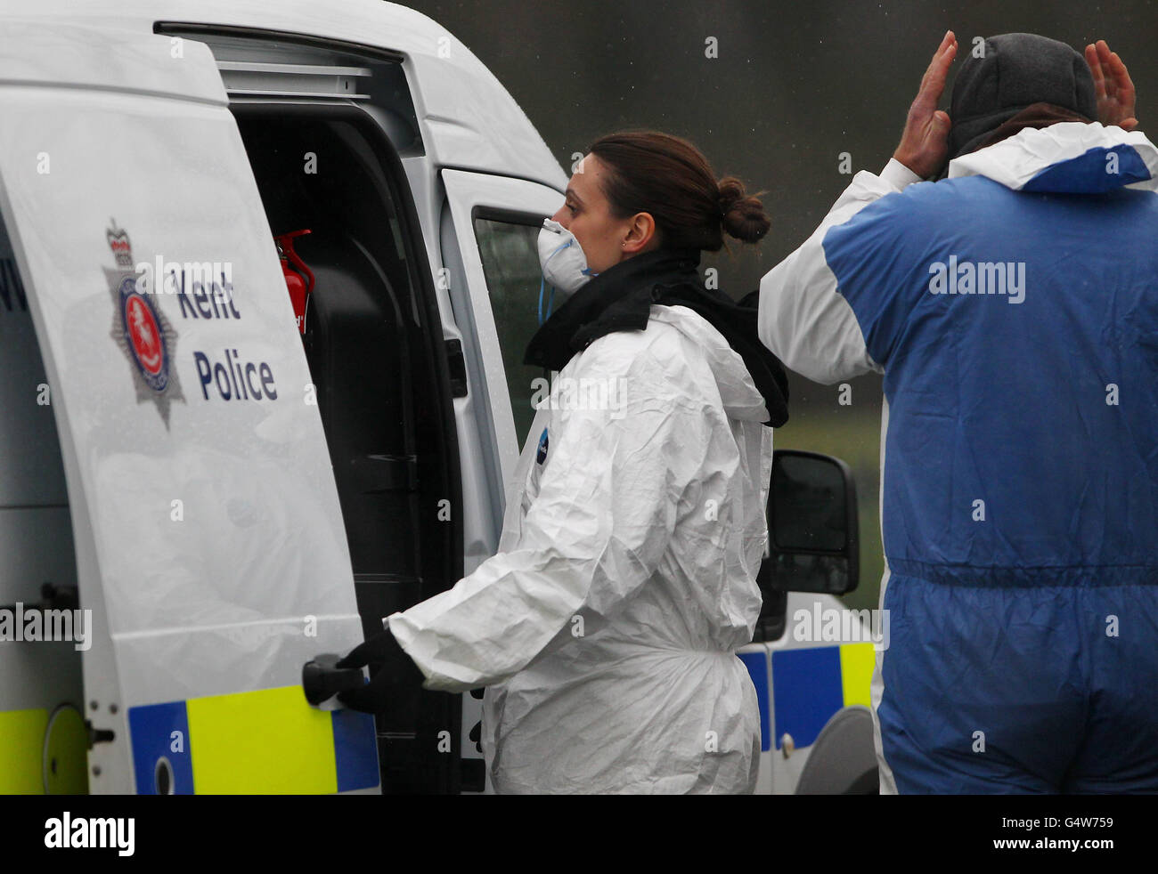 Police forensic officers enter the scene around Reed Pond in Canterbury