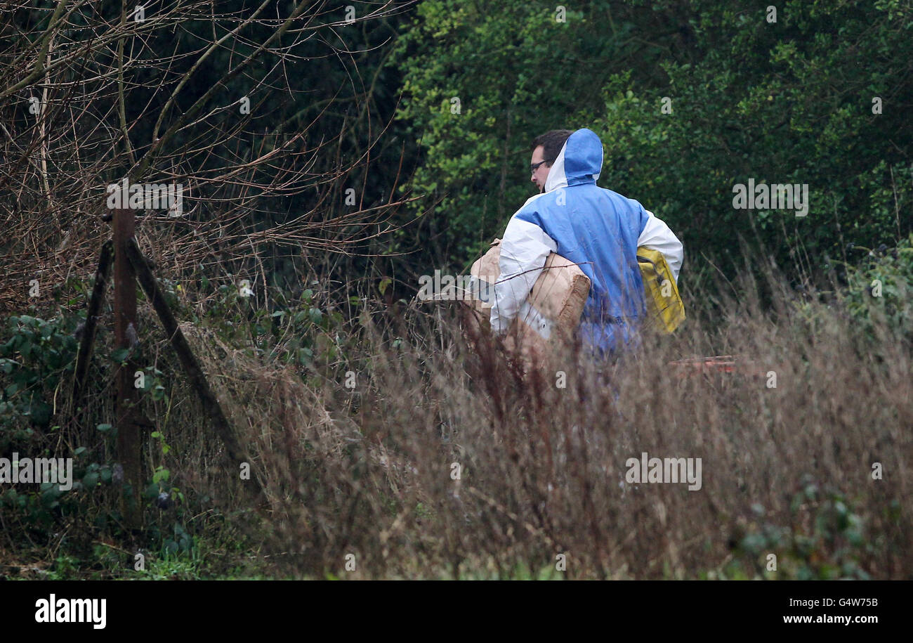Police forensic officers enter the scene around Reed Pond in Canterbury