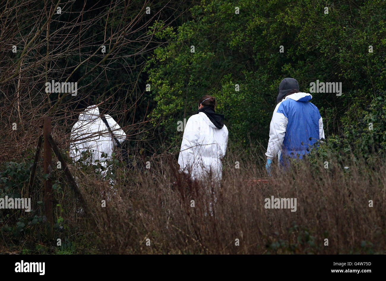 Police forensic officers enter the scene around Reed Pond in Canterbury