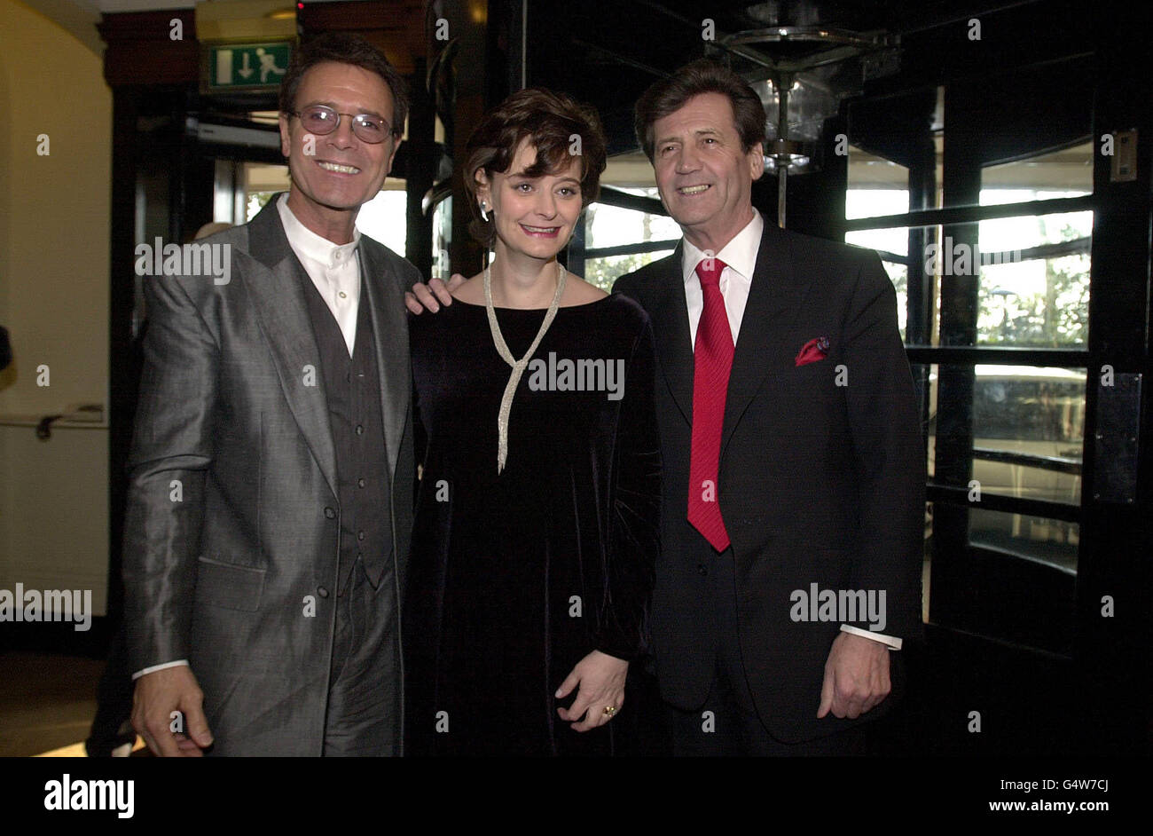 Prime Minister's wife Cherie Blair flanked by singer Sir Cliff Richard and broadcaster Lord Melvyn Bragg (right) after arriving at The Savoy in London, for the South Bank Show awards. Stock Photo