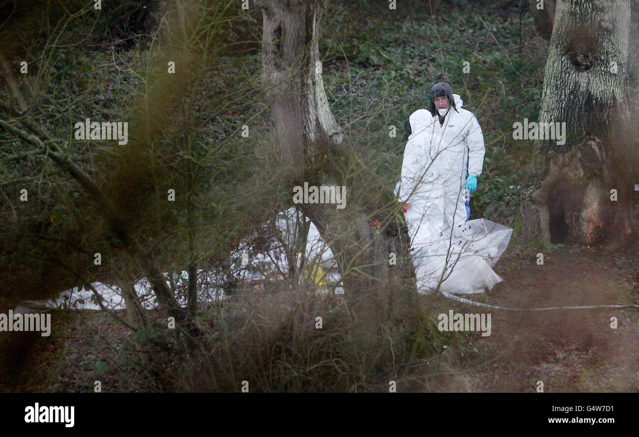 Police forensic officers at the scene around Reed Pond in Canterbury, Kent, following the discovery of two bodies. Picture date:Tuesday January 31, 2012. A 54-year-old man has been arrested on suspicion of murder following the discovery of two bodies in a pond. The bodies of the two men were found by police yesterday. The first was spotted by a member of the public who contacted the emergency services at around 12pm while the second was found by police divers at 9.40pm. See PA story POLICE Pond Photo credit should read: Gareth Fuller/PA Wire Stock Photo