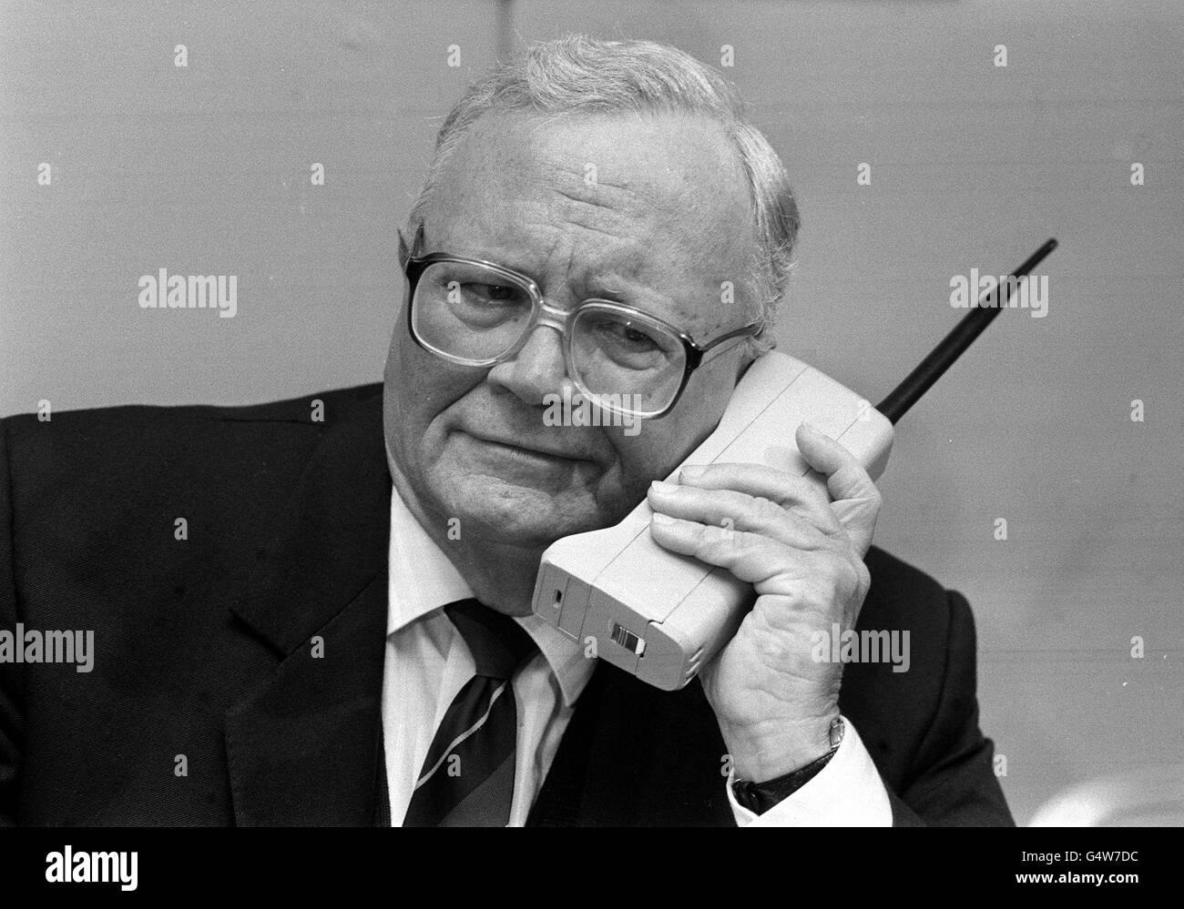 Sir Harry Secombe with mobile phone : 1990 Stock Photo
