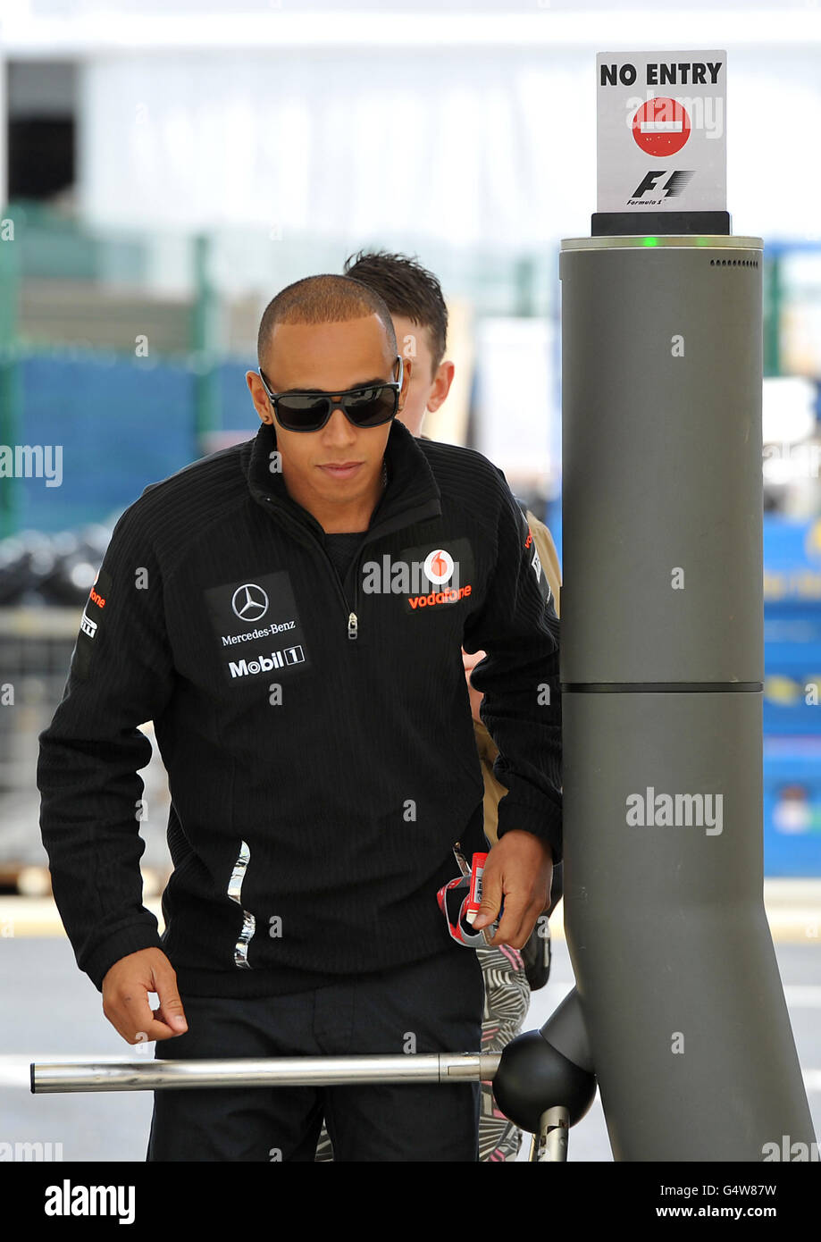 McLaren Mercedes' Lewis Hamilton arrives at Silverstone during paddock day for the Formula One Santander British Grand Prix at Silverstone Circuit, Northampton. Stock Photo