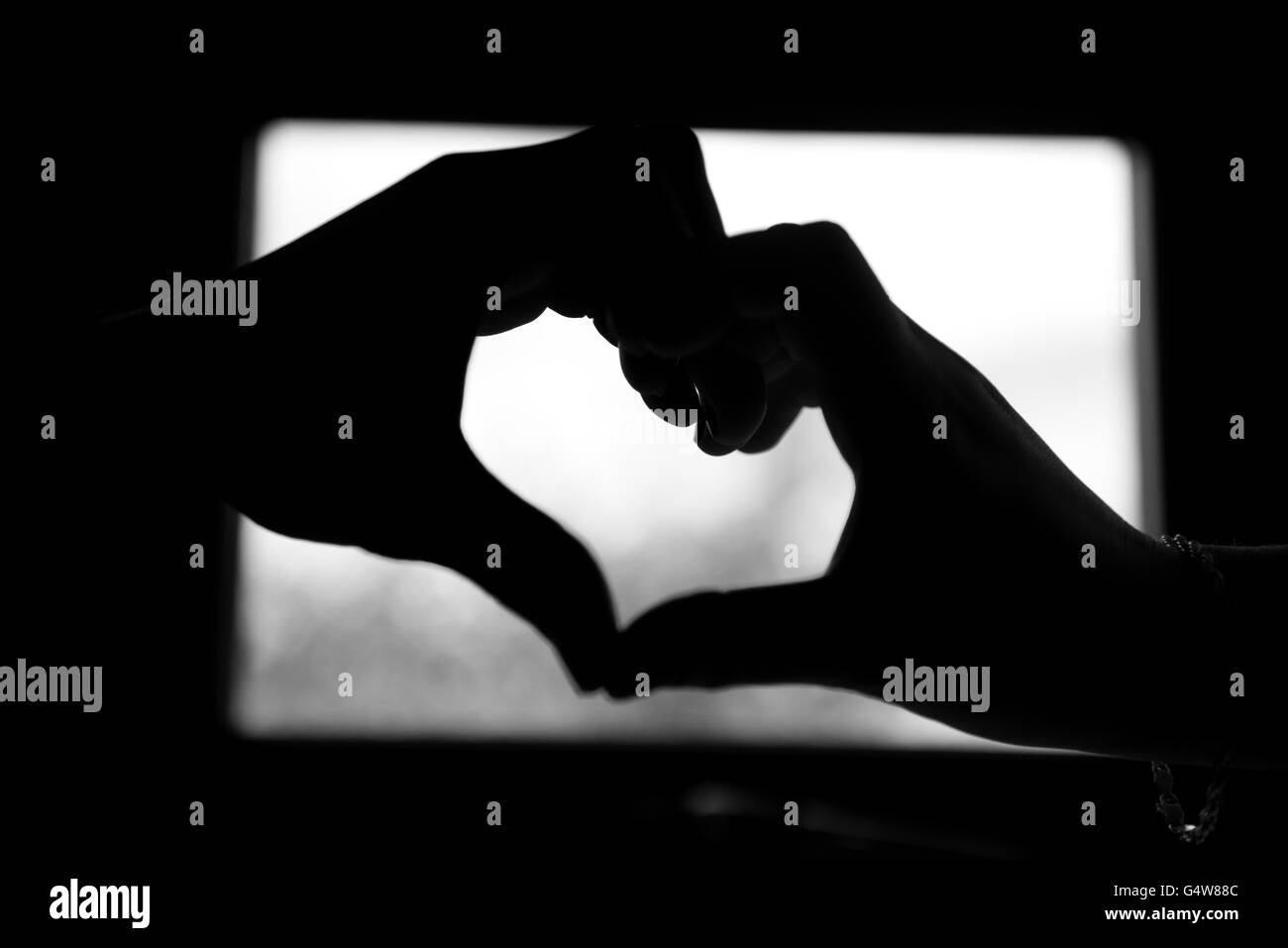 Hands touching silhouette hi-res stock photography and images - Alamy