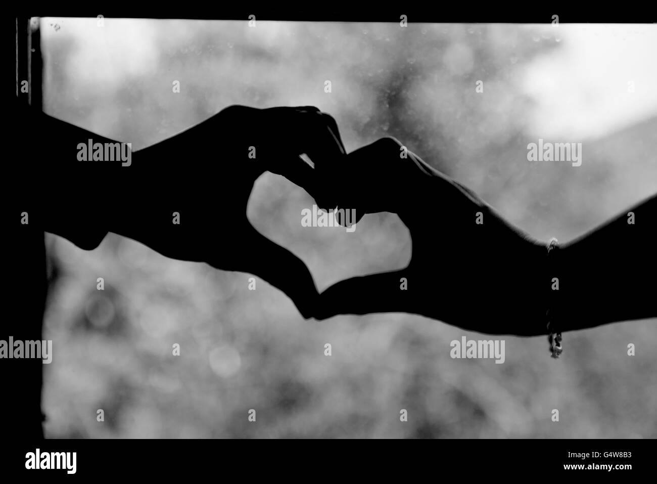 Hands touching silhouette hi-res stock photography and images - Alamy