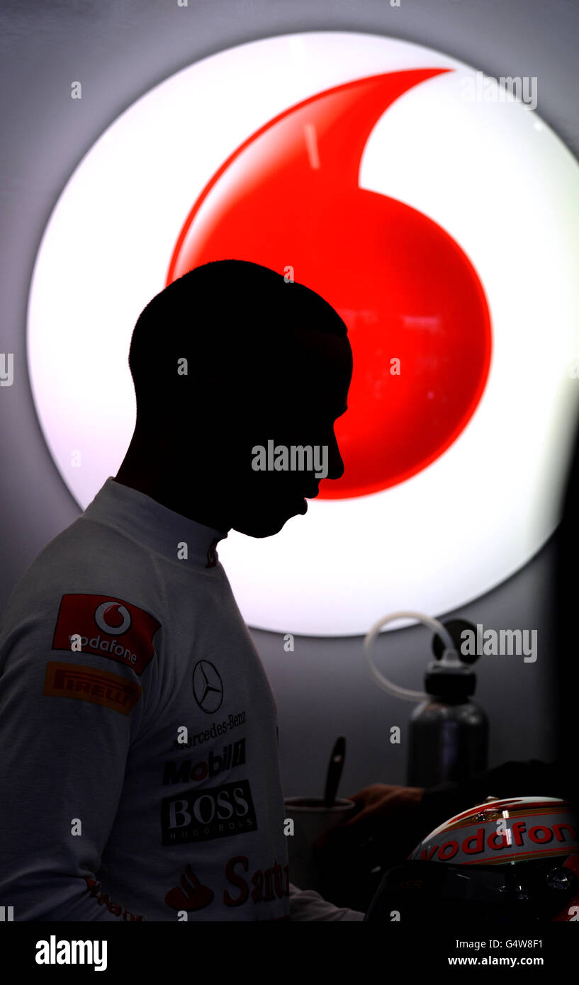 McLaren Mercedes' Lewis Hamilton in the team garage during the final practice session during Qualifying day for the Formula One Santander British Grand Prix Stock Photo