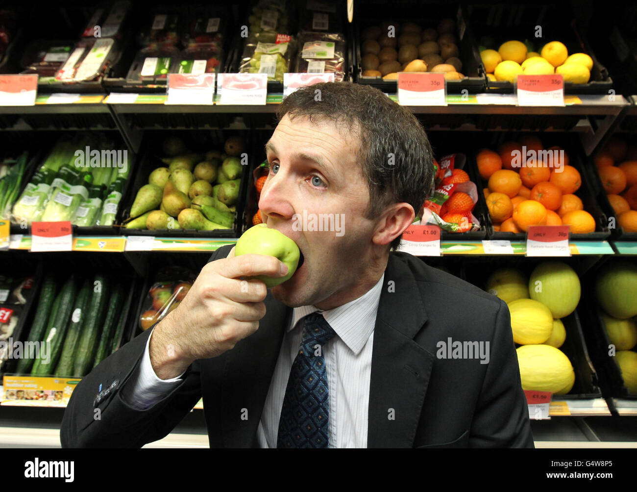Public health minister Michael Matheson MSP eats an apple as he
