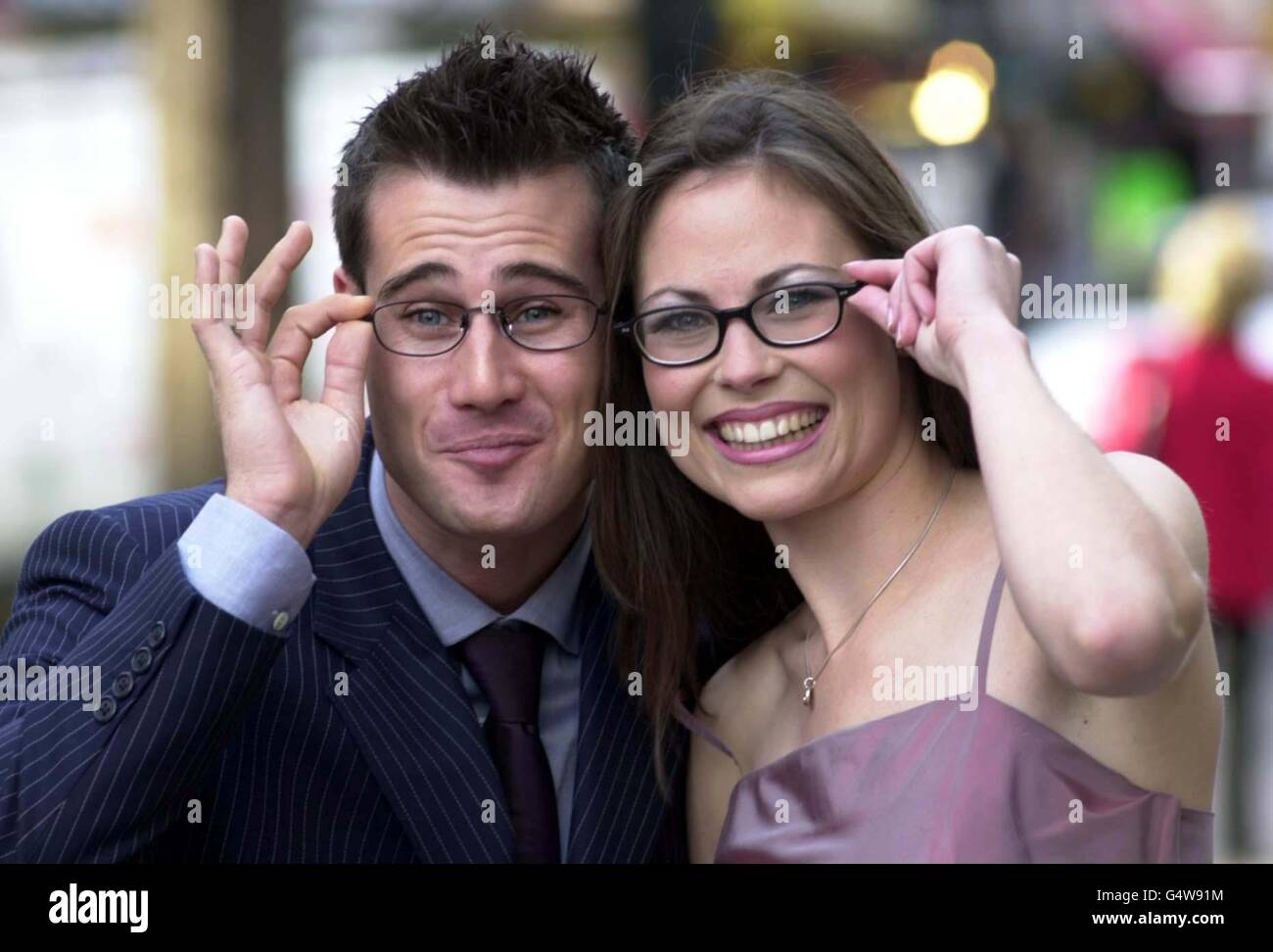 Television presenter and host of the Specsavers Opticians Look Of 99 competition Tim Vincent is joined by the winner of the sexiest specs wearer, Kimberley Stolz, a special needs teacher from Co. Derry. Stock Photo