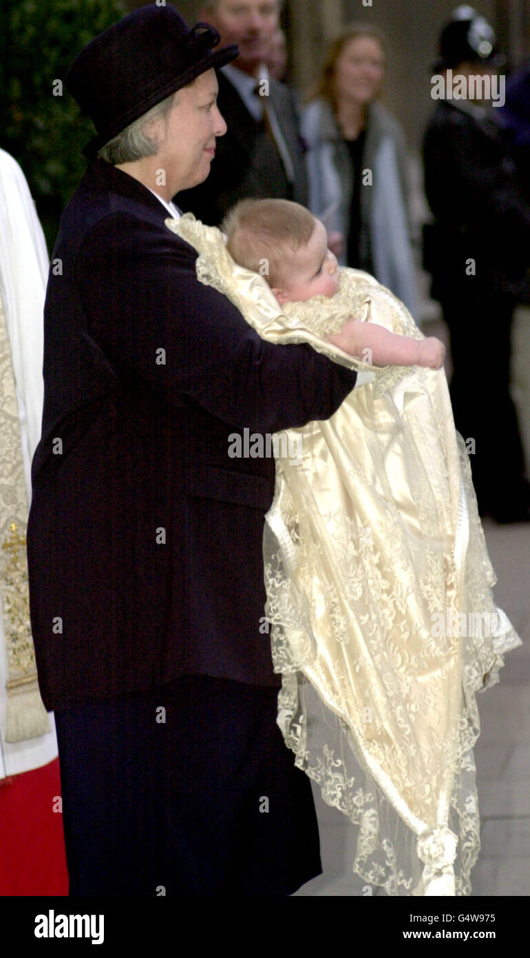 Charles Patrick Inigo Armstrong Jones, born on the 1st of July 1999, the son of Viscount and Viscoutess Linley, in the arms of a nanny, leaving The Queens Chapel at St. James' Palace after his christening. Stock Photo