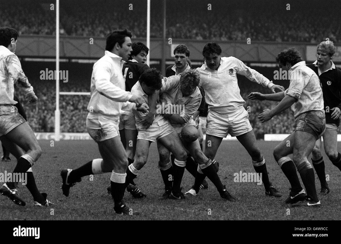 A tussle for a loose ball during the Calcutta Cup match between England and Scotland at Twickenham. The England teammates Richard Harding (L), Gary Pearce and captain Paul Dodge (R). Scottish players (L-R) Gavin Baird, Alan Tomes and Alister Campbell. Stock Photo