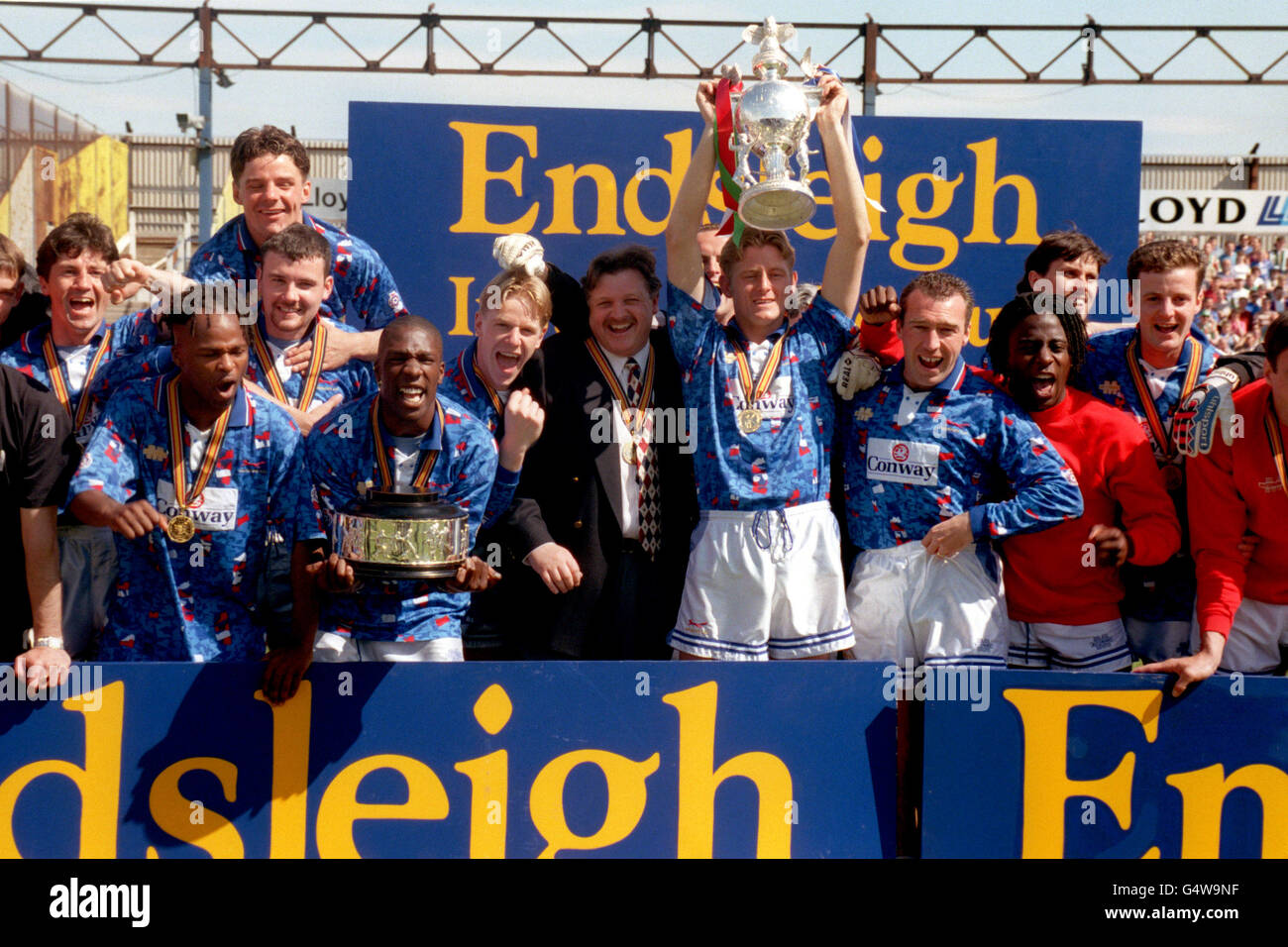 Carlisle United's David Reeves holds up the Third Division Champions ...