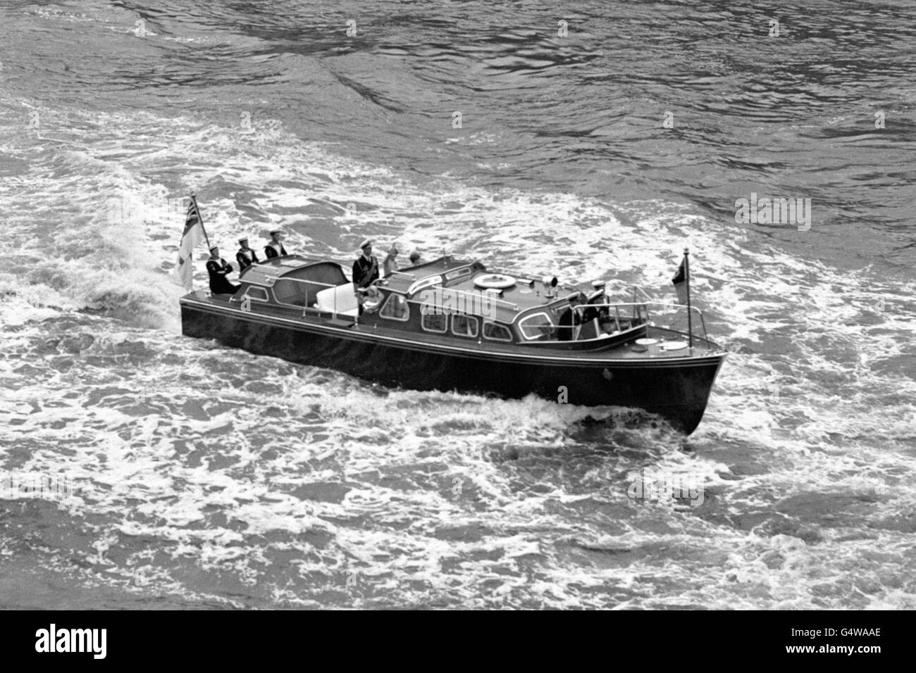 The Royal Barge on the River Thames bringing Queen Elizabeth II from the Royal Yacht Britannia, after returning from a tour of the Commonwealth. Stock Photo