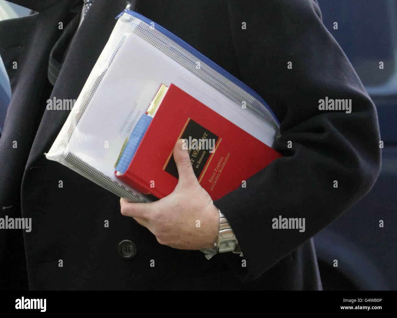 Ian Bailey carrying a book leaves the Supreme Court in Dublin, where he faces extradition to France for questioning over the murder of film-maker Sophie Toscan du Plantier. Stock Photo