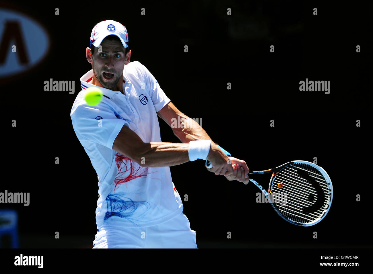 Tennis - 2012 Australian Open - Day Four - Melbourne Park. Serbia's Novak  Djokovic in actin against Colombia's Santiago Giraldo Stock Photo - Alamy