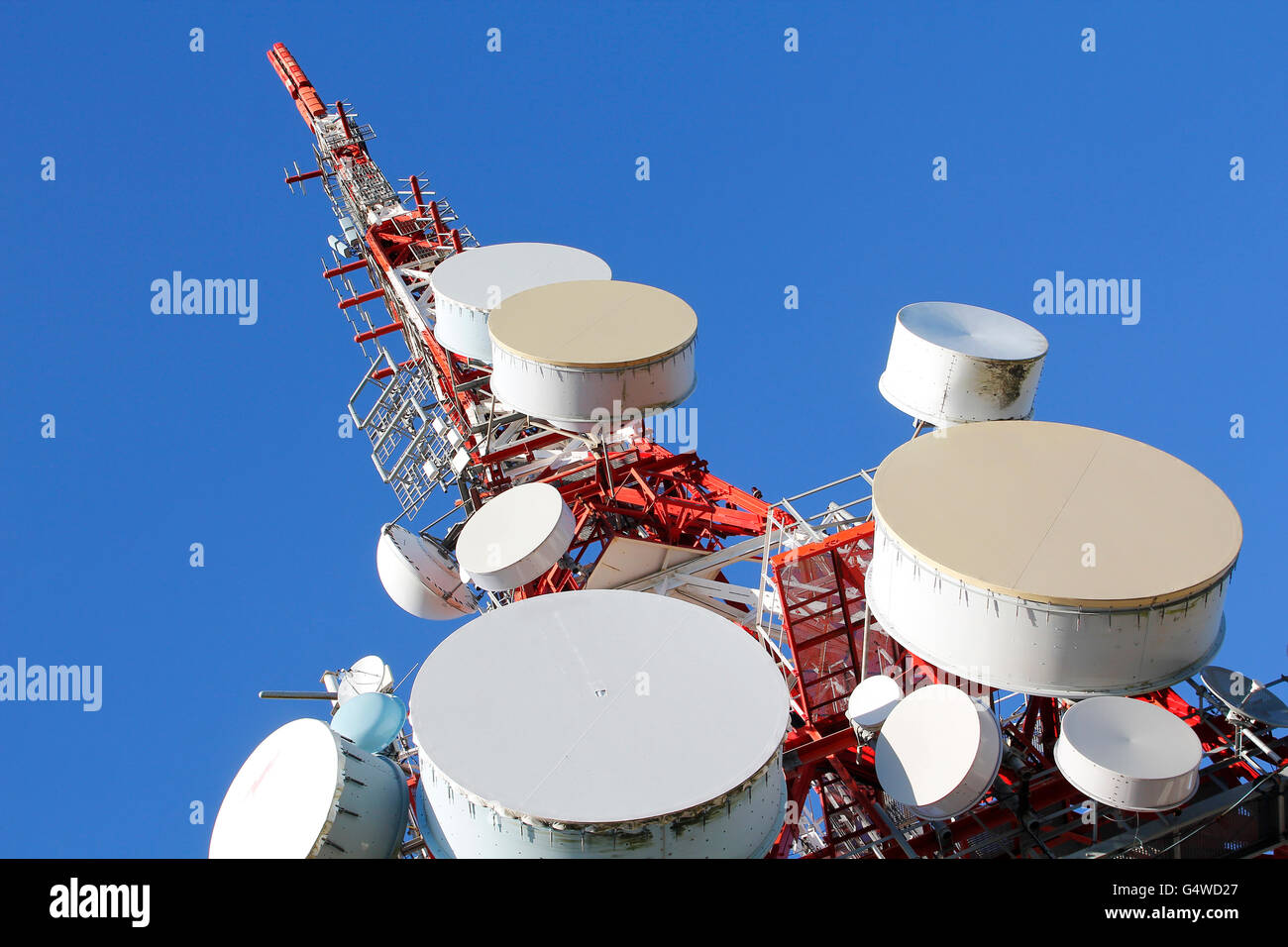Telecommunications tower against blue sky Stock Photo