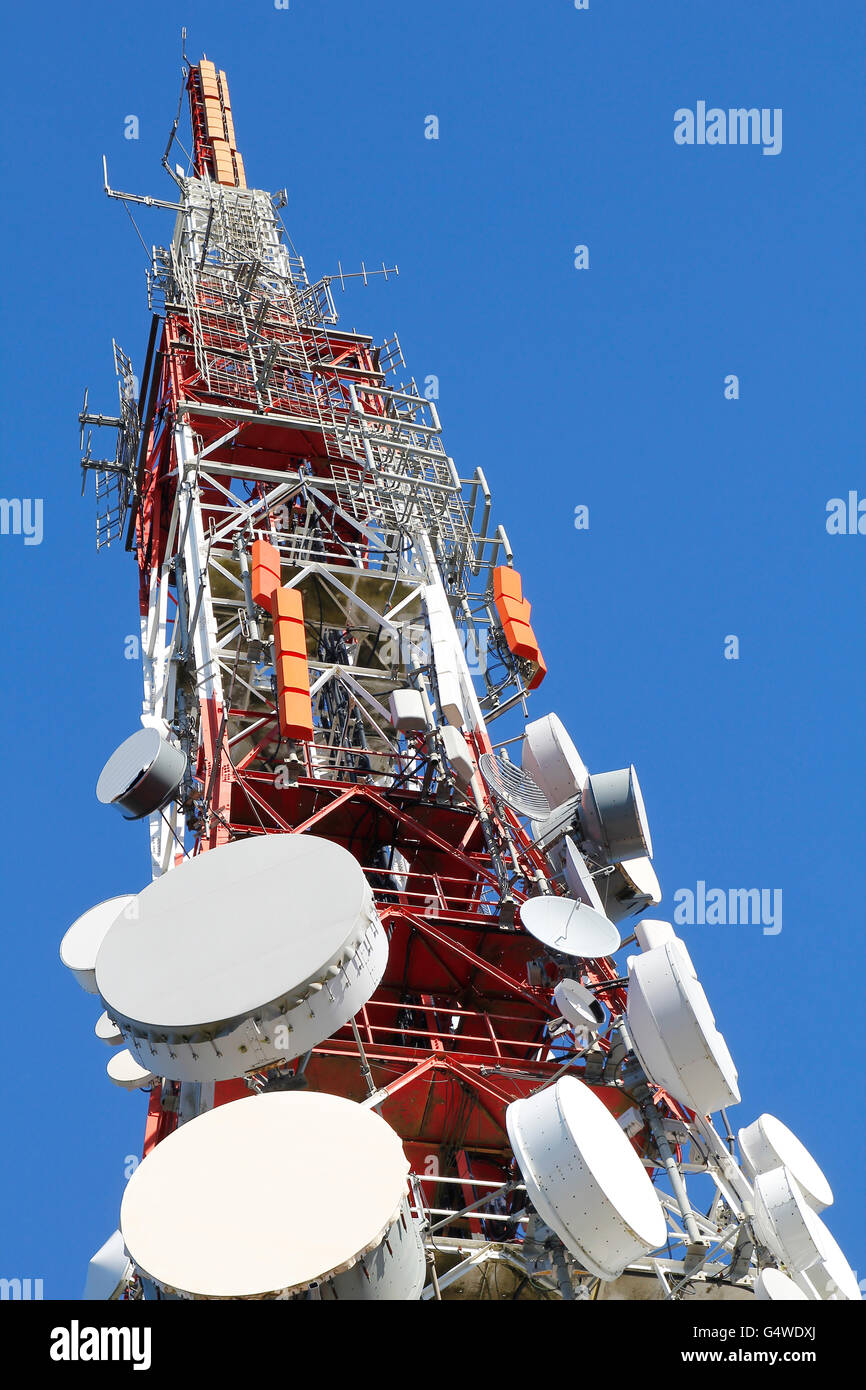 Telecommunication tower against blue sky Stock Photo