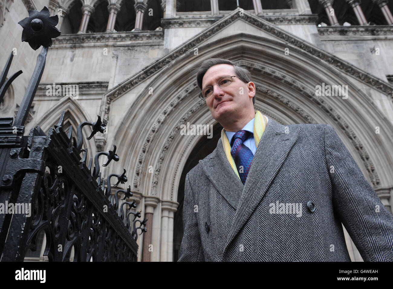 Attorney General Dominic Grieve QC leaves the High Court in London after Theodora Dallas, 34, a juror who carried out internet research at home while sitting at a criminal trial was jailed for six months for contempt of court. Stock Photo