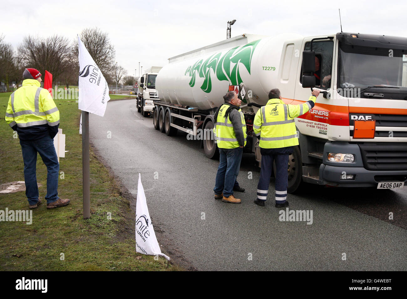 Tanker drivers, members of the Unite Union talk to fellow drivers on a picket line at the