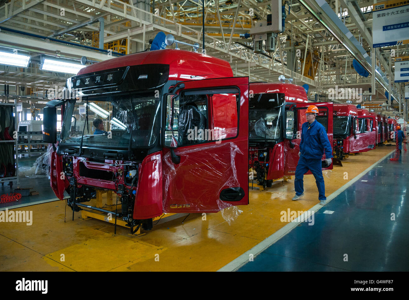 Workers assembling truck cabs at the plant making Hanvan trucks part of ...