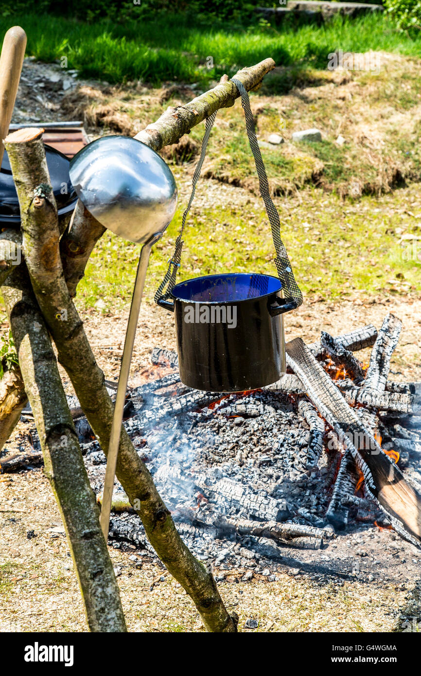 Stockpot, cooking over an open campfire, pea soup with sausages, Stock Photo