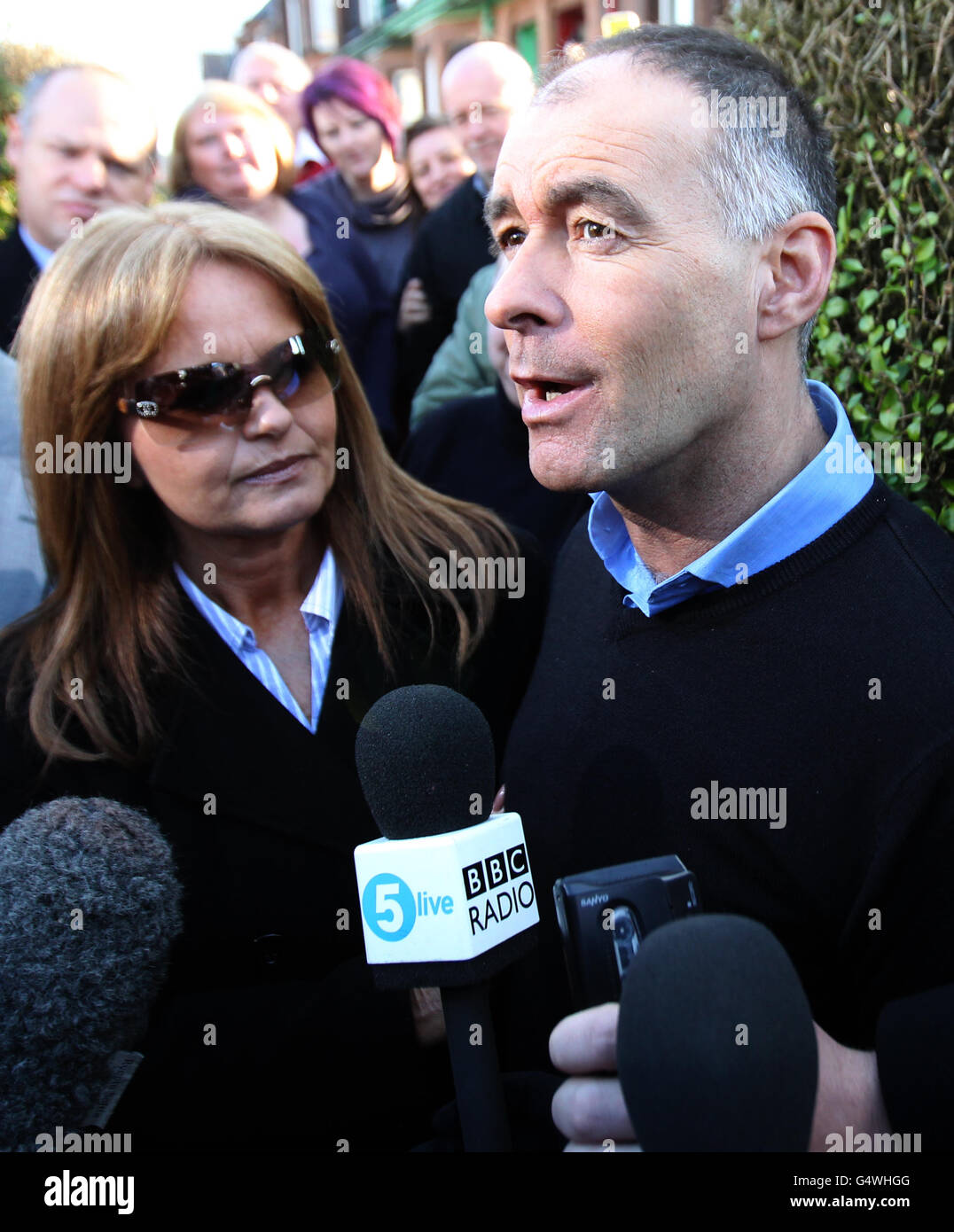 Former MSP Tommy Sheridan, accompanied by his wife Gail, speaks to the media after arriving home in Glasgow after leaving Castle Huntly Prison,near Dundee, after serving just over one year of his three-year sentence for lying under oath. Stock Photo