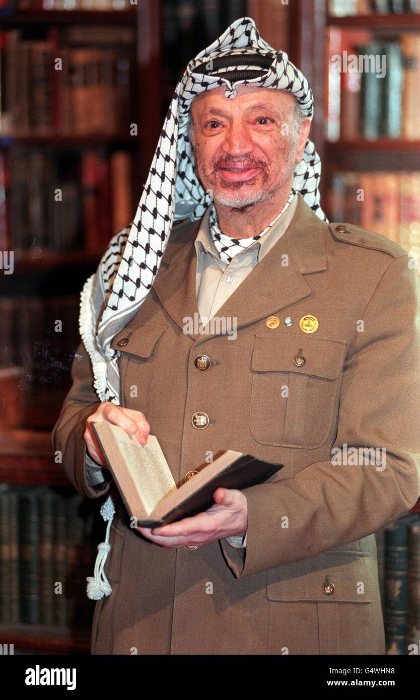 Chairman of the PLO Yasser Arafat holds a book before addressing the Oxford Union. Arafat, who earlier met Prime Minister John Major in Downing Street, is in Britain for a two day visit. 11/11/04: It was announced, that Palestinian leader Yasser Arafat has died. Stock Photo