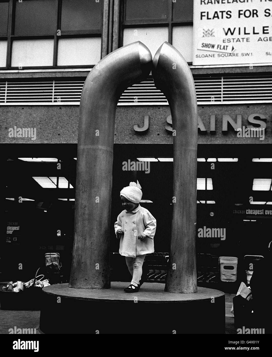 PA NEWS PHOTO 25/2/67 A CHILD PLAYS ON A SCULPTURE OUTSIDE A SAINSBURY STORE OFF THE KING'S ROAD, CHELSEA, LONDON. Stock Photo