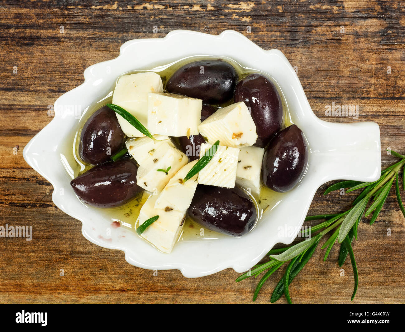 Feta diced goat's milk in oil and olives Stock Photo - Alamy