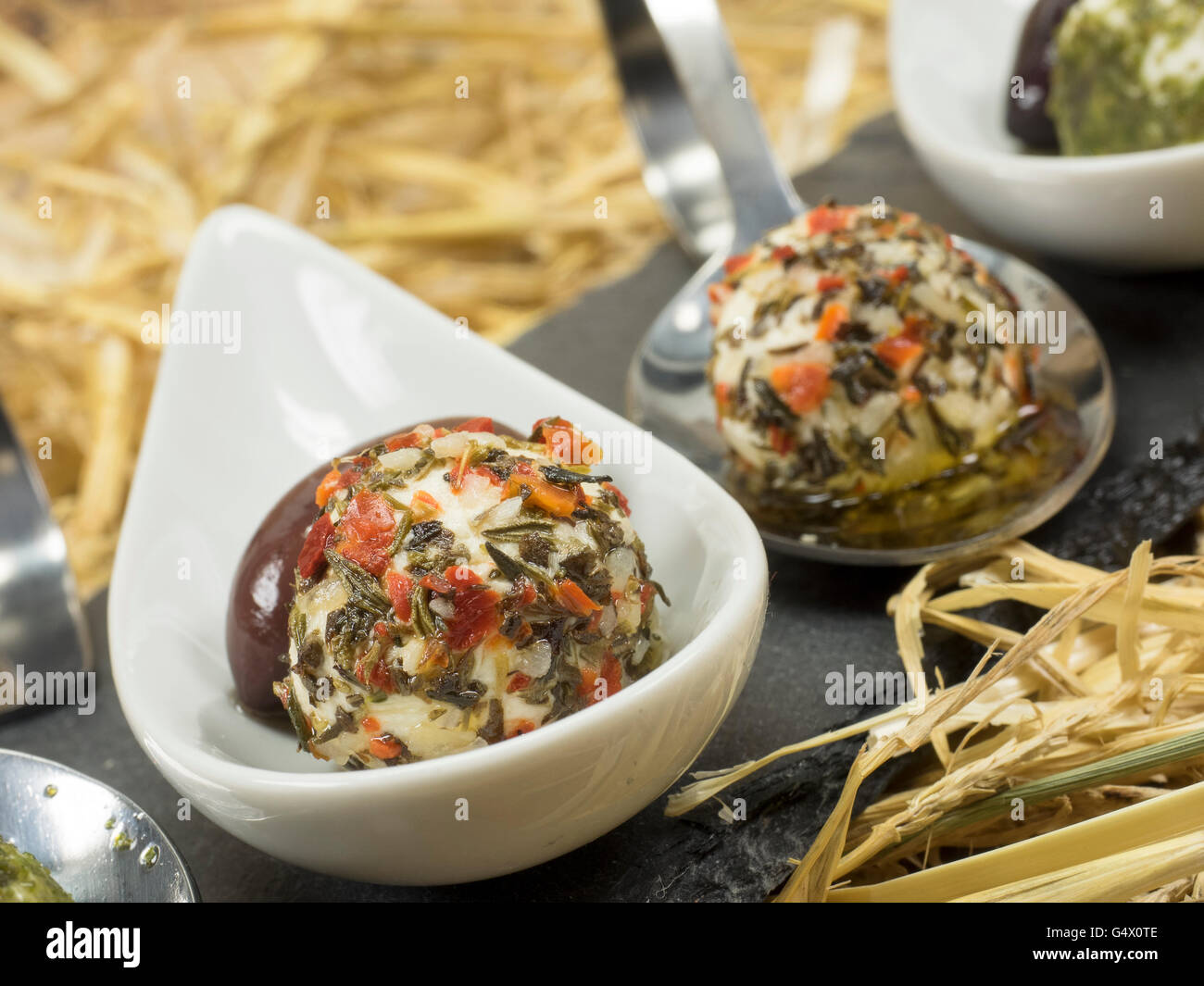 Cream cheese balls with herbs from goat's milk Stock Photo