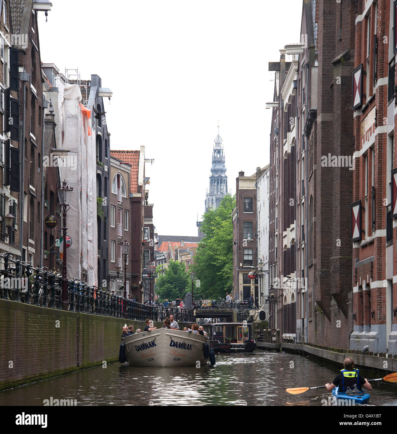 scenic picture of Amsterdam historic narrow houses both sides of the canal. Stock Photo