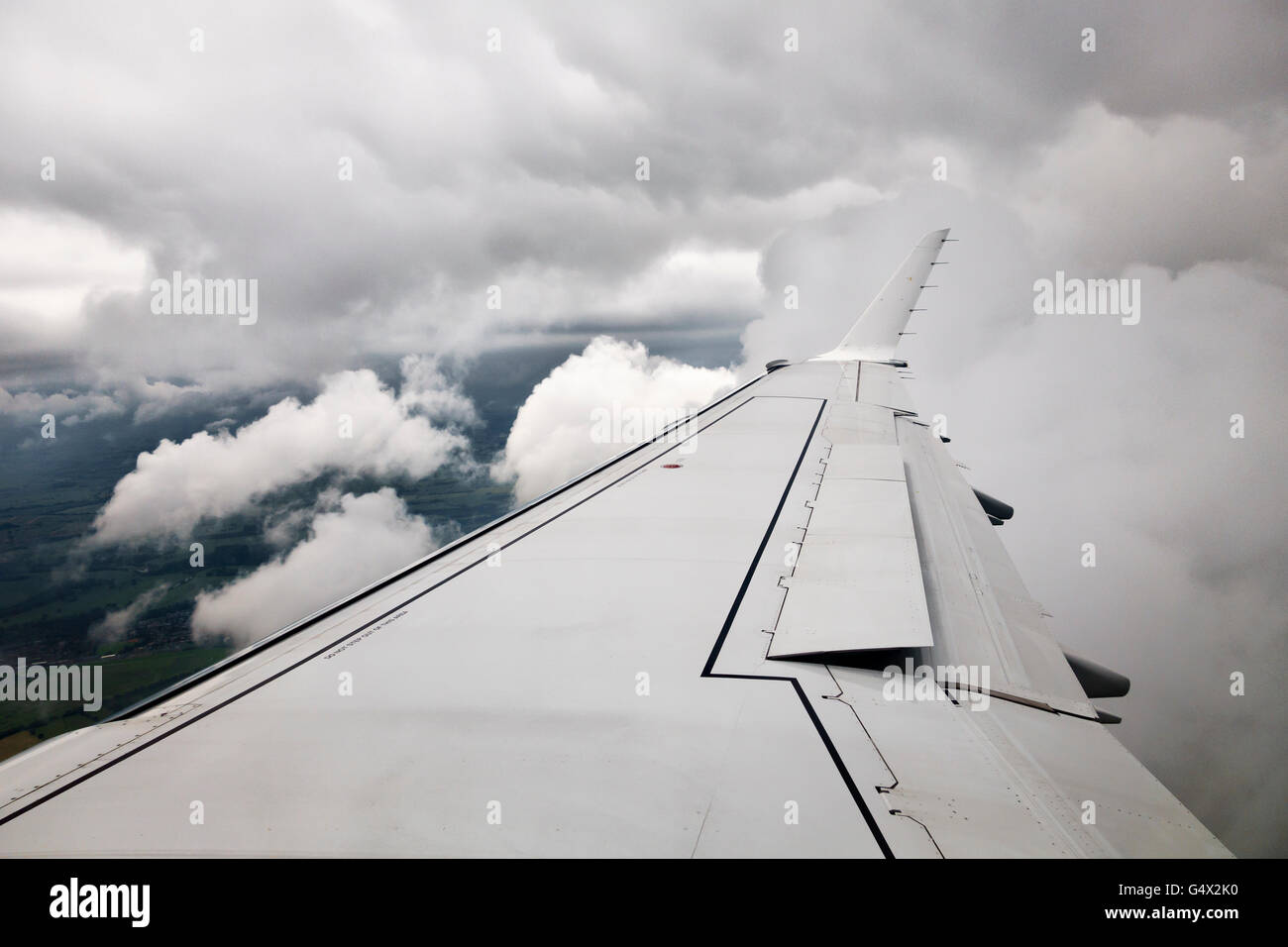 UK. View from an aircraft window as it descends to land through low cloud Stock Photo