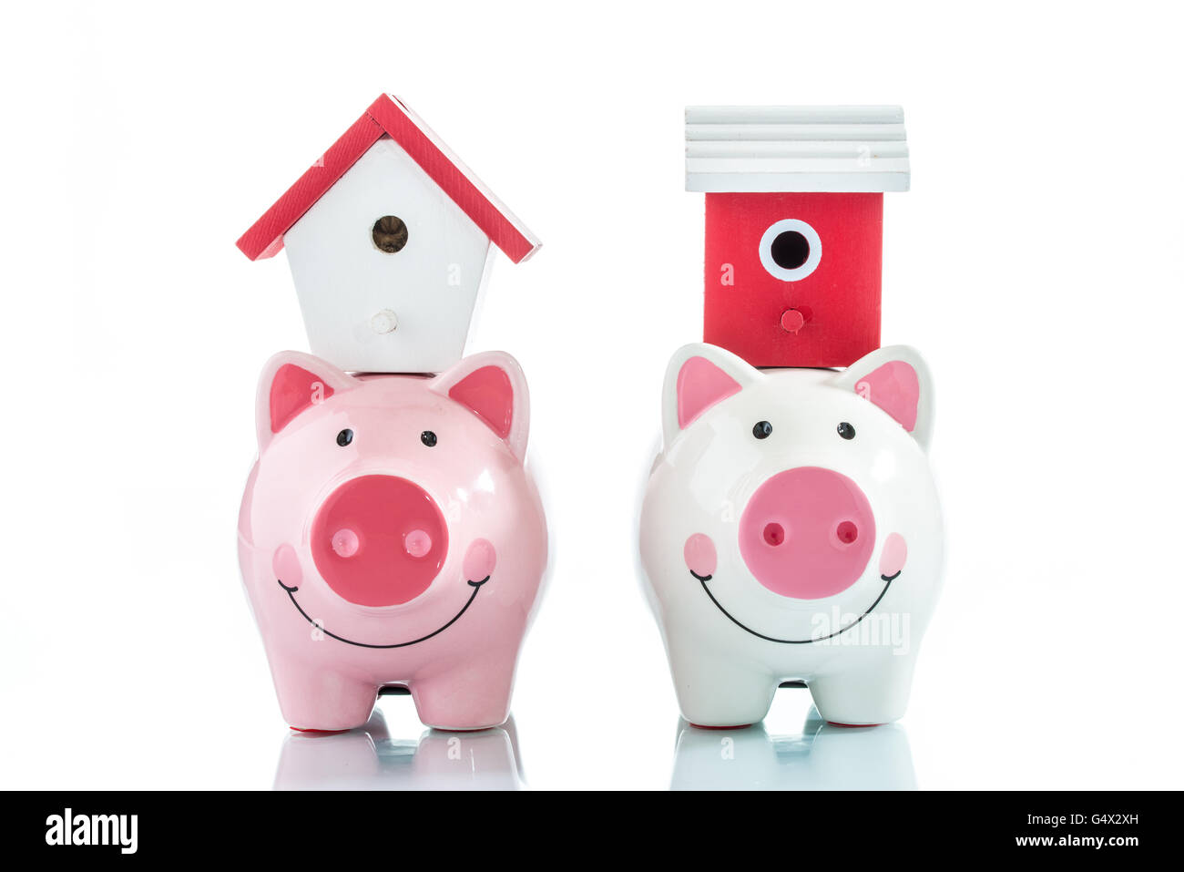 Saving to buy a house, piggy bank and house Stock Photo Alamy