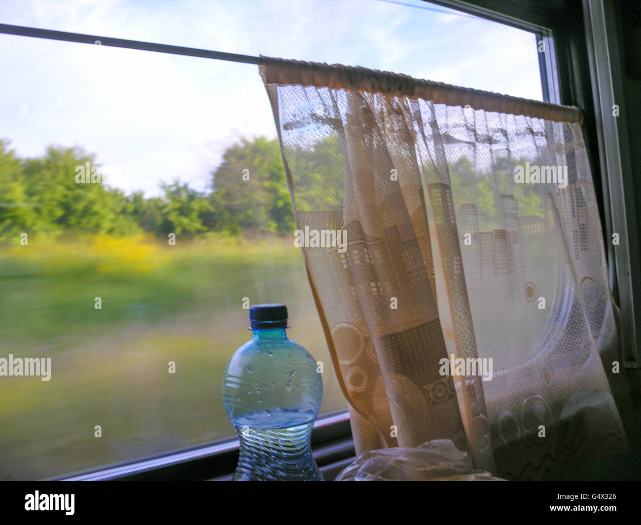 water bottle at a train window Stock Photo - Alamy