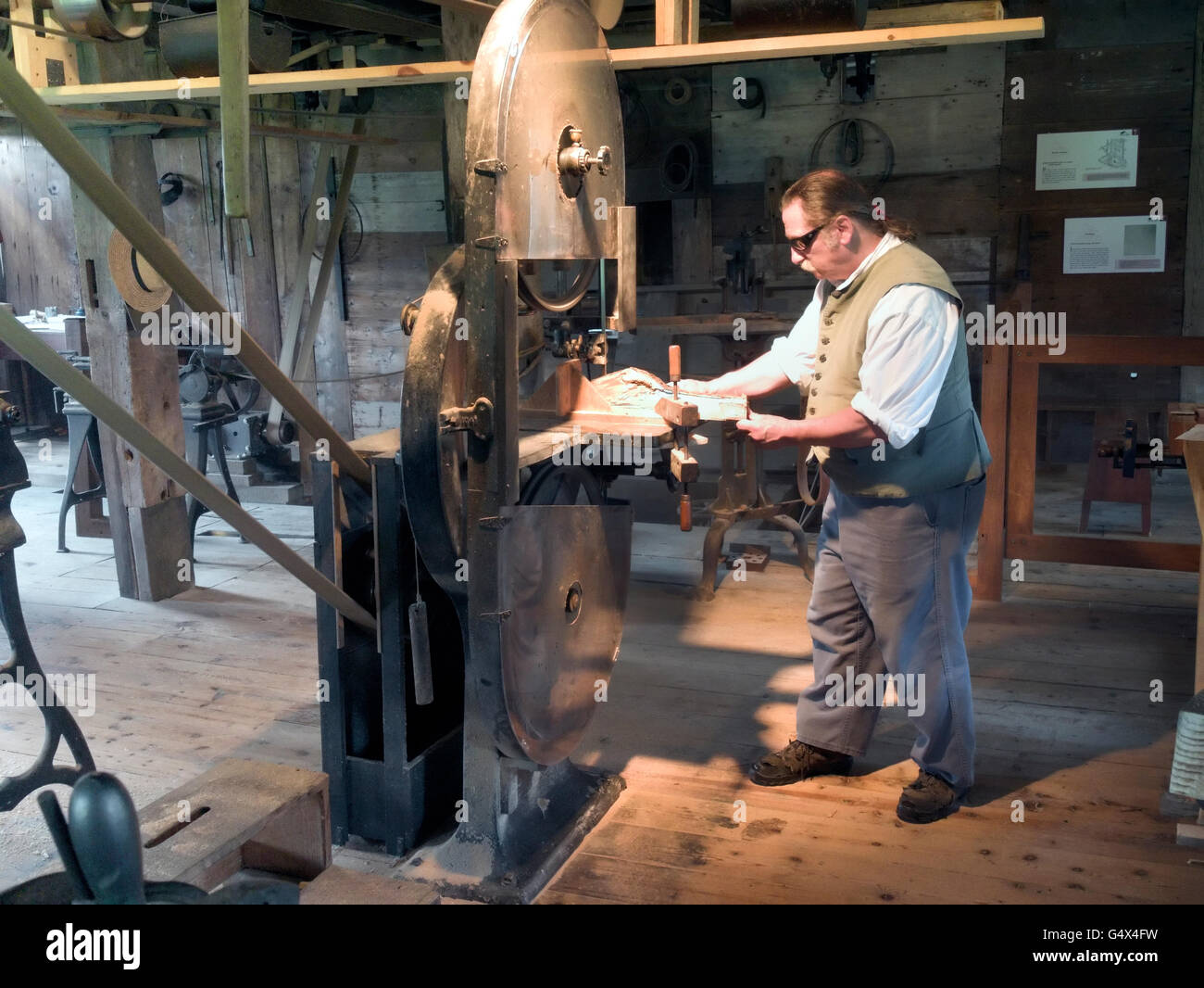 A man turning a lathre at wood working Display, Hancock Shaker Village, Massachusetts Stock Photo