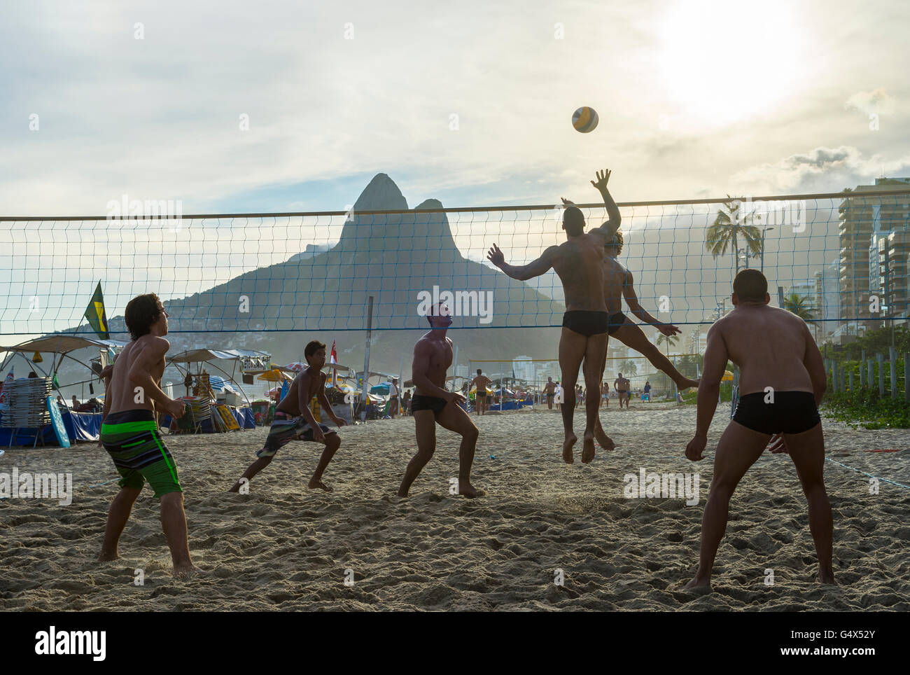 RIO DE JANEIRO - MARCH 20, 2016: Young carioca Brazilians play beach volleyball, an Olympic sport Brazil is favored to win. Stock Photo