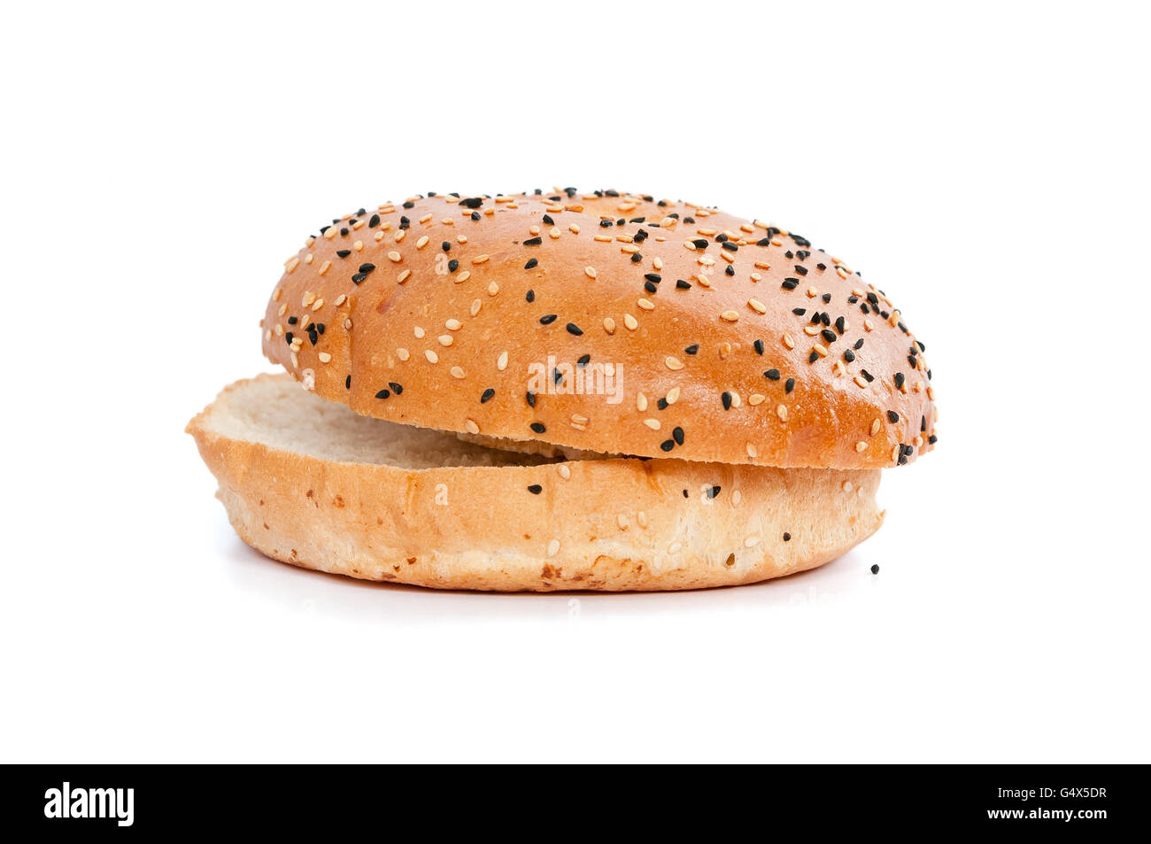 Burger bread with sesame is heating on a grill pan. Process of cooking self  made burgers at home Stock Photo - Alamy