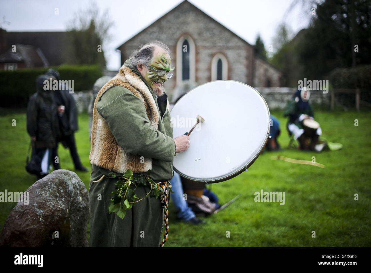 A drummer plays out a beat as dancers weave around the maypole at ...