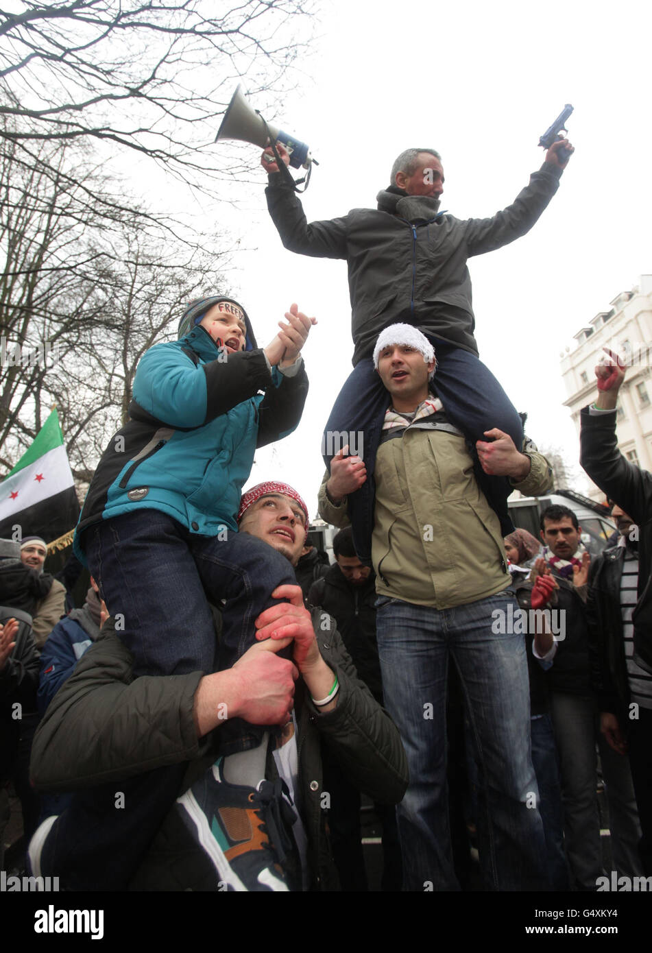 Protesters outside the Syrian Embassy in central London, amid reports of more than 200 people being killed in a deadly barrage in the city of Homs, Syria. Stock Photo