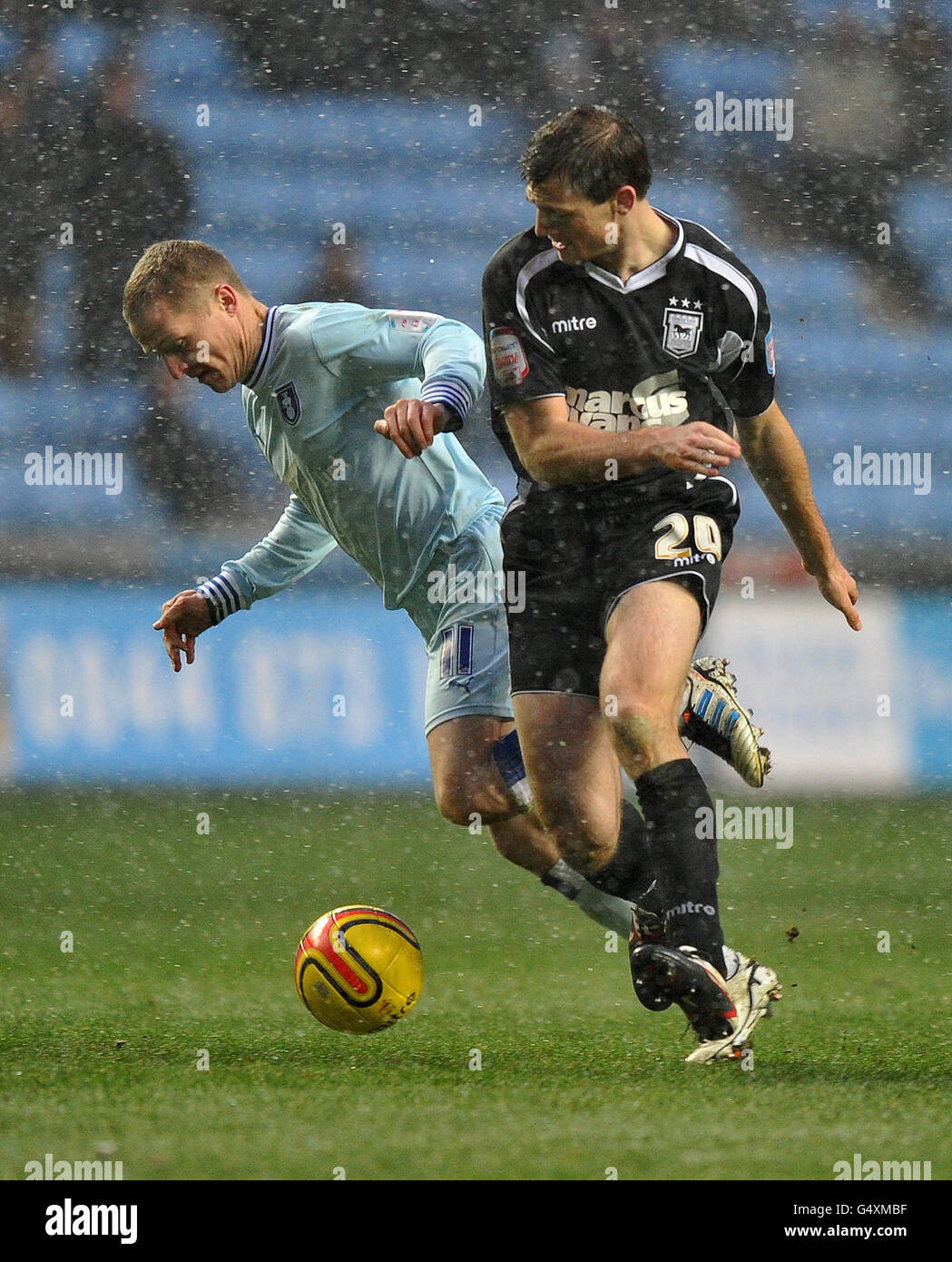 Coventry City's Gary McSheffrey and Ipswich Town's Tommy Smith battle for the ball during the npower Football League League Championship match at the Ricoh Arena, Coventry. Stock Photo