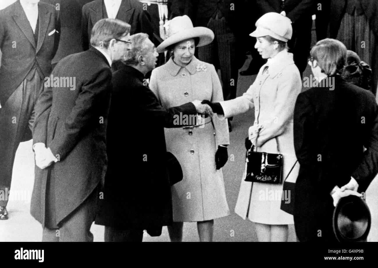 Emperor Hirohito of Japan shakes hands with Princess Anne, watched by Queen Elizabeth II, at Victoria Station, at the start of his State visit to Britain. Stock Photo